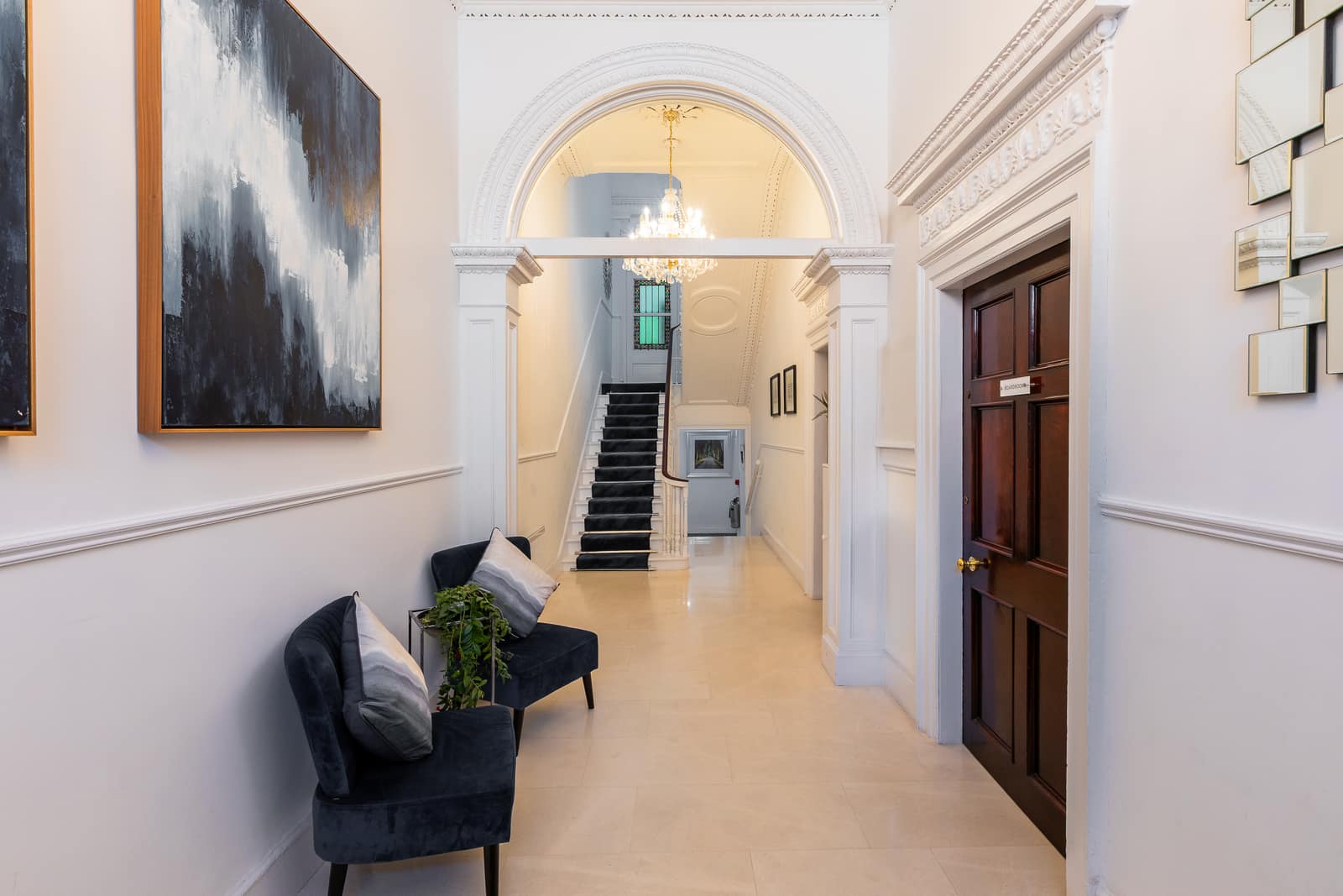 38 Fitzwilliam Street Upper — Georgian entrance hall with archway and chandelier
